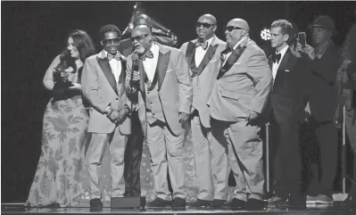  ?? PHOTOS BY ROBERT HANASHIRO/USA TODAY ?? Blind Boys of Alabama accept the award for Best Roots Gospel Album during the 66th annual Grammy Awards at the Peacock Theater in Los Angeles on Sunday. Memphis producer and engineer Matt Ross-spang co-produced the album, “Echoes of the South.”