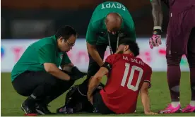  ?? Photograph: Themba Hadebe/AP ?? Mohamed Salah receives treatment during Egypt’s Africa Cup of Nations match against Ghana.
