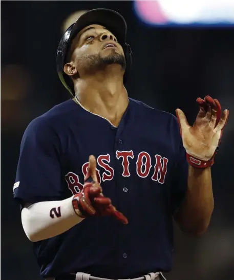  ?? ASSOCIATED PRESS ?? HAVE A SEAT: Xander Bogaerts, shown celebratin­g his three-run homer Friday night, was not in the starting lineup for last night’s rain-delayed game in Detroit.