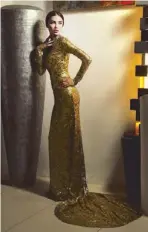  ??  ?? oldfinger: Shoppers will soon have this oor-length liquid-looking sequin gown ustom-fitted to their size and shape for only 5,000.