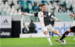  ?? AFP ?? Juventus forward Cristiano Ronaldo (right) in action during the second leg of their Italian Cup (Coppa Italia) semifinal against AC Milan at the Allianz stadium in Turin on Friday. The match ended in a goalless draw but Juventus advanced on the virtue of their away goal from their first leg. —