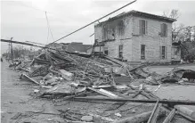  ?? Stew Milne/associated Press ?? Debris from local businesses covers the street in Selma, Ala., after a tornado. The La Niña weather phenomenon is gone.