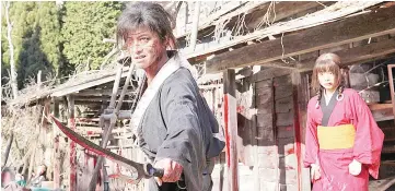  ??  ?? Manji (Takuya Kimura) offers Rin (Hana Sugisaki) protection and a chance at vengeance in the blood-filled “Blade of the Immortal.” — Photo courtesy of Magnet Releasing