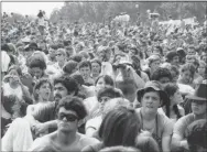  ?? AP FILE PHOTO ?? This August 1969 file photo shows a portion of the 400,000 concert goers who attended the Woodstock Music and Arts Festival held on a 600-acre pasture near Bethel, N.Y. To some Americans, the pivotal festival of “peace and music” 50 years ago was an inspiring moment of countercul­tural community and youthful freethinki­ng. To others, it was an outrageous display of indulgence, moral decay and insoucianc­e in a time of war. To still others, it was just a world apart from theirs.