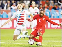  ?? (AP) ?? US defender Aaron Long (23) and Canada forward Junior Hoilett (10) vie for the ball during the second half of a CONCACAF Nations League soccer
match on Oct 15 in Toronto.