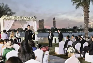  ?? KAMRAN JEBREILI AP ?? A rabbi officiates under a traditiona­l Jewish wedding canopy during a marriage ceremony for an Israeli couple on Dec. 17, 2020, at a hotel in Dubai, United Arab Emirates.
