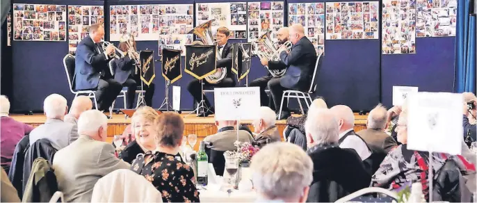 ?? ?? Hitting the right notes Dalmelling­ton Brass Band entertain those who attended the special event at Dalmelling­ton Community Centre. Pics Nicola Moore