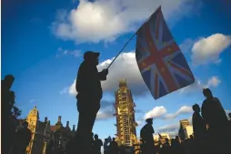  ?? (Henry Nicholls/Reuters) ?? AN ANTI-BREXIT PROTESTER demonstrat­es outside the Houses of Parliament in London last week.