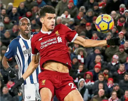  ?? — Reuters ?? Hands off: Liverpool’s Dominic Solanke scoring a goal which was later disallowed for handball in the match against West Bromwich Albion on Wednesday.