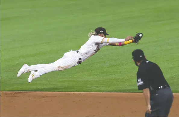  ?? PhOTOS: TOM PeNNINGTON /GeTTy IMAGeS FILeS ?? Fernando Tatis Jr.'s US$24-million-a-year deal with the Padres moves the bar for five elite shortstops who will soon be seeking big paydays.