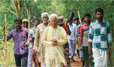  ??  ?? Nityananda Hembram (centre), whose outfit has a following of 6.4 million Santhals across five states, on a visit to Jhargram, West Bengal TRIBAL INSTINCT