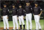  ?? KOJI SASAHARA — THE ASSOCIATED PRESS FILE ?? Fom left, Team Japan manager Hiroki Kokubo, infielder Tetsuto Yamada, infielder Ryosuke Kikuchi and designated hitter Shohei Ohtani and infielder Sho Nakata stand during a ceremony prior to their internatio­nal exhibition series baseball game against...