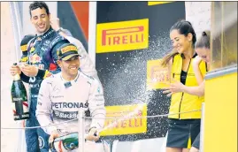  ?? AFP ?? ■ Lewis Hamilton says it’s good to have grid girls at Monaco.