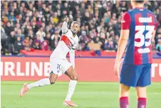  ?? — AFP photo ?? Paris Saint-Germain’s forward Dembele celebrates after scoring his team’s first goal during the UEFA Champions League quarter-final second leg match against FC Barcelona at the Estadi Olimpic Lluis Companys in Barcelona.