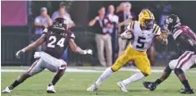  ?? THE ASSOCIATED PRESS ?? LSU running back Derrius Guice (5) tries to escape Mississipp­i State defensive back Chris Rayford (24) and linebacker Dezmond Harris (11) during their SEC matchup in September.