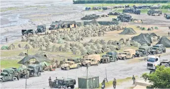  ?? — AFP file photo ?? A general view of the temporary camp of US Marines participat­ing in a live fire exercise as part of the Philippine­s-US amphibious landing exercises (PHIBLEX) at Crow Valley in Capas, Tarlac province.