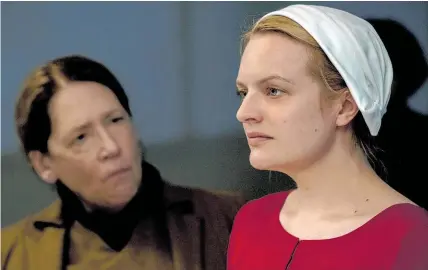  ?? Picture / Hulu via AP ?? Ann Dowd (left) and Elisabeth Moss in a scene from The Handmaid’s Tale.