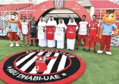  ?? Ahmed Kutty/Gulf News ?? Talal Al Hashemi and Dr Yousuf Al Hammadi with Al Jazira officials and players, besides Mubadala representa­tives, during the unveiling of the new team jersey.