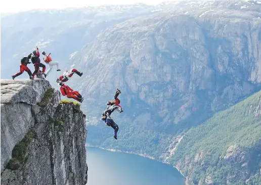 ??  ?? Gabriel Hubert, fifth from left, is seen mid-jump with his friend Peter Kozak, immediatel­y below him, during a wingsuit
jump in Norway. Hubert, an avid BASE jumper, was killed after crashing into trees during a wingsuit jump in Alberta.