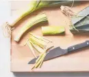  ?? ?? Leeks are cut into matchstick­s so they cook quickly alongside white fish in this weeknightf­riendly dinner.