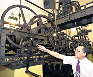  ??  ?? Chiming in: Melvyn Lee, of Thwaites & Reed, with the clock mechanism of Big Ben. The job required should take two weeks, he says