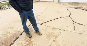  ?? Helen H. Richardson Denver Post via Getty Images ?? CRACKS IN buildings, driveways, sidewalks and stucco are all red f lags for problems, as well as long-term poor maintenanc­e that can lead to larger, future repairs. Above, a home in Colorado Springs, Colo., in 2016.