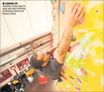  ??  ?? n LOOKING UP: Goolistan Cooper gets to grips with sport climbing at Westway Sports and Fitness Centre