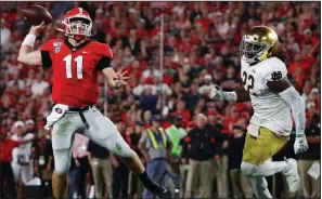  ?? AP/JOHN BAZEMORE ?? Georgia quarterbac­k Jake Fromm went 20-of-26 passing, including a 15-yard touchdown pass to Lawrence Cager early in the fourth quarter, for 187 yards to lead the No. 3 Bulldogs to a 23-17 victory over No. 7 Notre Dame on Saturday in Athens, Ga.
