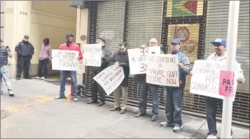  ??  ?? A handful of persons protested outside of the Guyana Consulate in New York