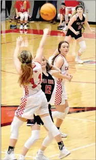  ??  ?? Farmington junior Carson Dillard launches a desperatio­n half-court shot after Pea Ridge took a 1-point lead when a foul was called with players jostling for position on an in-bounds pass with 5 seconds left. Farmington lost a physical girls basketball contest, 58-57, on Tuesday, Jan. 12, at Cardinal Arena.