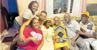  ?? ?? Westmorela­nd centenaria­n Keturah Headley-Campbell (centre) is surrounded by her children and grandchild­ren while celebratin­g her 101st birthday in Waterworks, Westmorela­nd on Saturday, March 9, 2024.