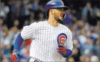  ?? Kamil Krzaczynsk­i ?? The Associated Press Bonanza product Kris Bryant rounds the bases Friday after homering off Cardinals pitcher Adam Wainwright in the fourth inning of the Cubs’ 8-4 win at Wrigley Field.