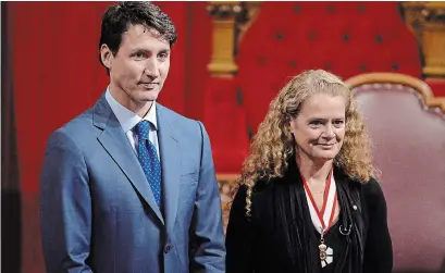  ?? ADRIAN WYLD THE CANADIAN PRESS ?? Gov. Gen. Julie Payette stands alongside Prime Minister Justin Trudeau during her installati­on ceremony in 2017.