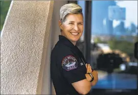  ?? Francine Orr Los Angeles Times ?? OFFICER Erin Enos says it’s “kind of surreal” to see fellow police wearing a pride patch. Enos, who is lesbian, grew up in an area where coming out was unaccepted.