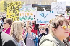  ?? — AFP photo ?? Thousands gathered and marched in a picket line outside the Oklahoma state Capitol building during the third day of a statewide education walkout in Oklahoma City, Oklahoma.