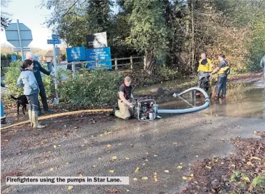  ??  ?? Firefighte­rs using the pumps in Star Lane.