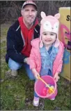  ??  ?? LEFT: Brooklyn Stang, 2, was one of 1,500 kids who collected Easter eggs at the 15th annual Victory Life Fellowship Church Easter Egg Hunt & Pancake Breakfast Friday at Kelowna’s Parkinson Recreation Centre. RIGHT: Sean McKee and his daughter Janelle, 3.
