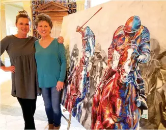  ?? Staff photo by Aaron Brand ?? ■ Women for the Arts members and Party with Picassos organizers Robin Proctor, left, and Judy Jones stand with Tyler Arnold’s signature art at the Regional Arts Center. The acrylic and mixed-media work, “The Daily Double,” will be auctioned at Party...