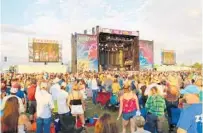  ?? STAFF FILE PHOTO ?? Thousands gathered for the Runaway Country Music Fest last year. Jason Aldean and Brad Paisley are among this year’s headliners.