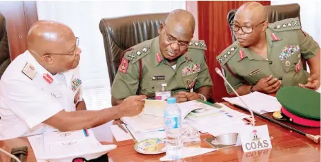  ?? Photo: State House ?? From right: Chief of Defence Staff, Gen. Abayomi Olonisakin; Chief of Army Staff, Lt.-Gen. Tukur Y. Buratai; and Chief of Naval Staff, Vice Admiral Ibok-Ete Ekwe Ibas, during the Armed Forces Council meeting presided over by President Muhammadu Buhari...