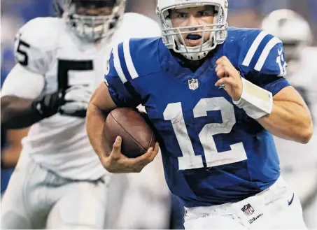  ?? Sam Riche / Mcclatchy-tribune News Service ?? Andrew Luck leaves Raiders defender Sio Moore behind on the 19-yard touchdown run that put the Colts ahead to stay.