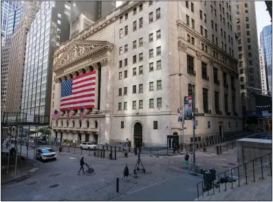  ?? (AP/Mary Altaffer) ?? A large American Flag hangs Monday on the New York Stock Exchange. Stocks fell to an eight-week low Wednesday.