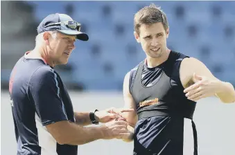  ??  ?? Chris Woakes talks with England bowling coach Chris Silverwood.