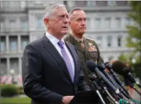  ?? Associated Press ?? n Defense Secretary Jim Mattis, left, accompanie­d by Joint Chiefs Chairman Gen. Joseph Dunford, speaks to members of the media Sunday outside the West Wing of the White House in Washington regarding the escalating crisis in North Korea’s nuclear threats.