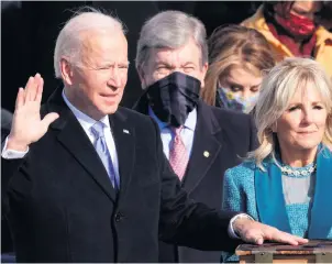  ??  ?? New beginning:
Joe Biden is sworn in as US President during his inaugurati­on