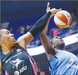  ?? Dallas Morning NEWS/TNS ?? Dallas Wings forward Kayla Thornton (6) tries to get a hand on an offensive rebound from Atlanta Dream center Elizabeth Williams (1) during the third quarter at College Park Center in Arlington, Texas, on August 25, 2019.