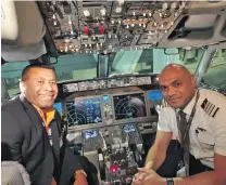  ?? Tuisue in the MAX 8 cockpit. ?? Sevens legend Waisale Serevi with Fiji Airways Captain Etika