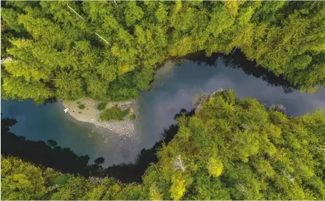  ??  ?? Above: yet another tranquil anchorage.
Keala at Turnbull Cove, Broughton Archipelag­o.
Left: seen from above, the Marble River up Quatsino Sound on Vancouver Island’s west coast