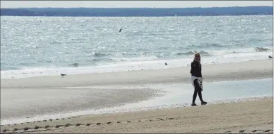  ?? Matthew Brown / Hearst Connecticu­t Media ?? A visitor takes in the Long Island Sound view on the last day of summer at Greenwich Point Park on Sept. 21.