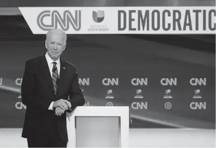  ??  ?? With several states delaying their primaries, former Vice President Joe Biden can’t reach the required majority of delegates until May or June to capture the Democratic nomination.